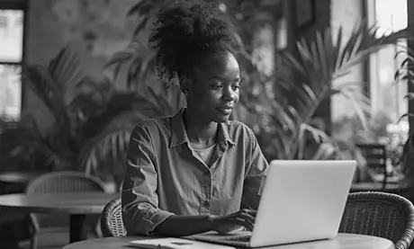 Ghanaian business owner using a professional website to attract customers