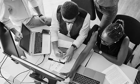 Group of web designers collaborating in a modern Ghanaian tech office