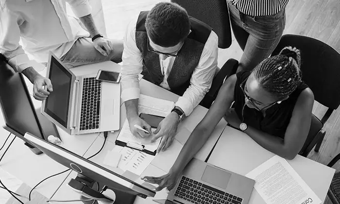 Group of web designers collaborating in a modern Ghanaian tech office